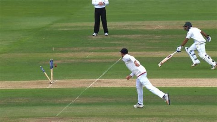 Can a batsman stop the ball with hand?