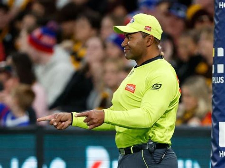 Can you bowl from behind the umpire?