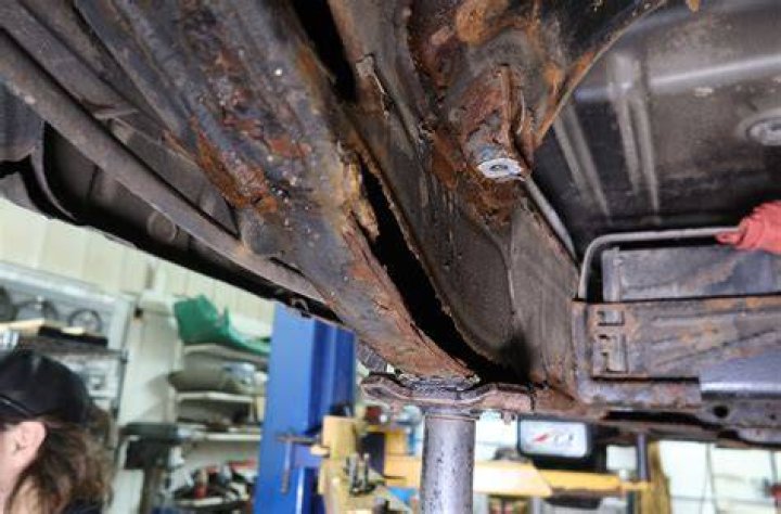Can you put body filler over rust?
