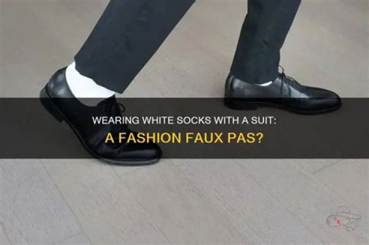 Can you wear white socks with a suit?