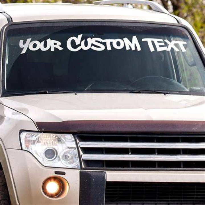 Do I need a UK sticker on the front of my car?