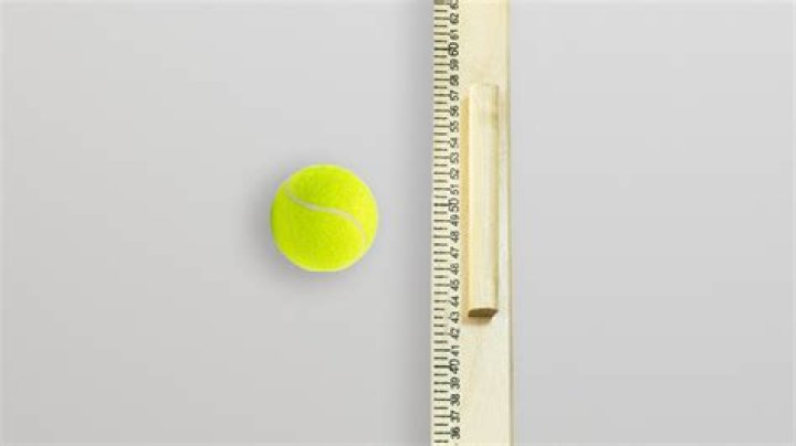 How do you measure the temperature of a tennis ball?