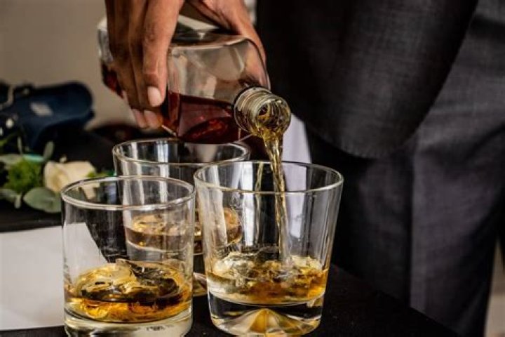 How do you pour whiskey on the rocks?