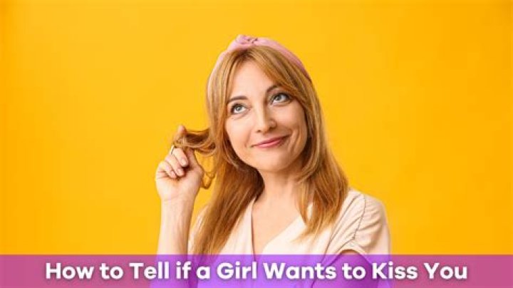 How do you tell if a girl wants to kiss you?