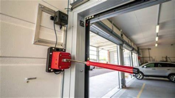 How does a garage door emergency release work?