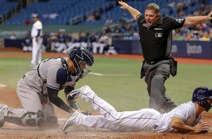 How does an umpire call a ball?