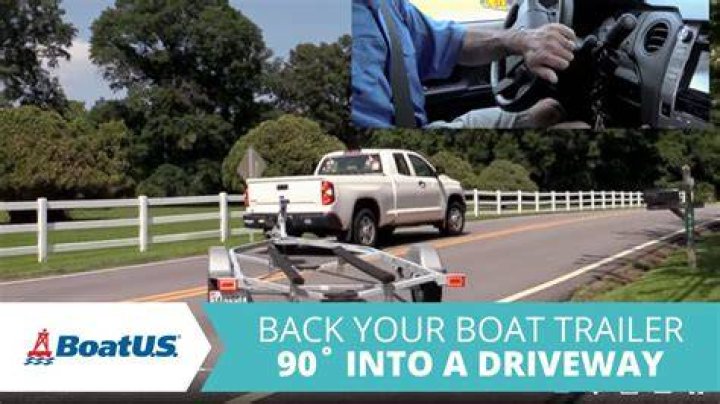How far do you back a boat trailer into the water?