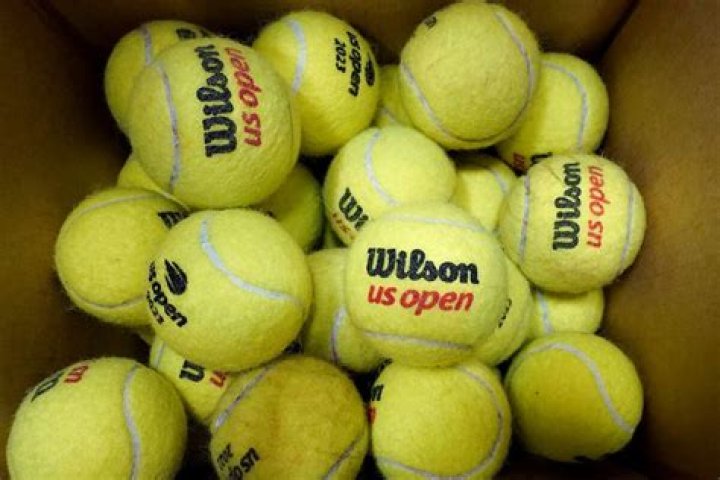How many tennis balls are used in a professional match?