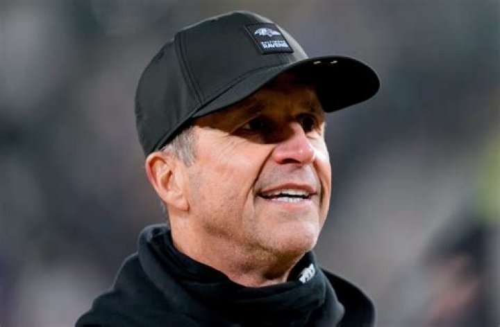 How much money does John Harbaugh make a year?