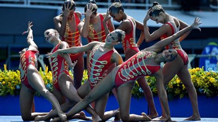 What do artistic swimmers wear?