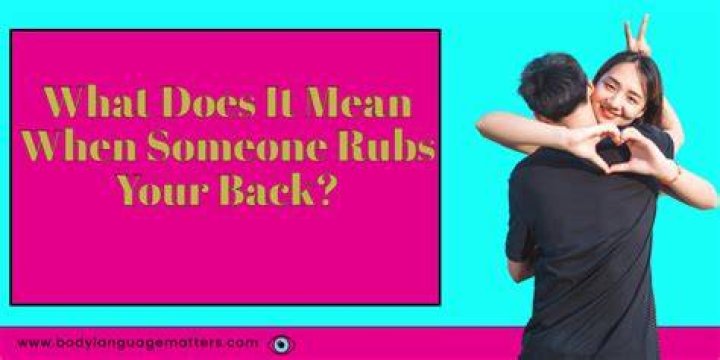 What does it mean when someone pats your back while hugging?