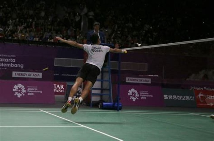 What happens if a player strikes the shuttle and it bounces on the tape and goes over the net?