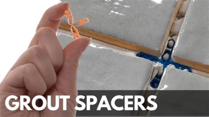 What happens if you grout over tile spacers?