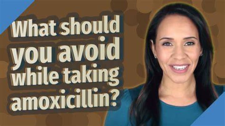 What should you avoid while taking amoxicillin?