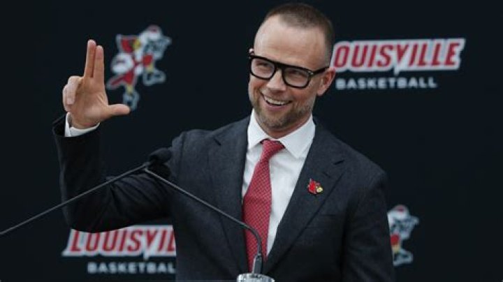Where is Louisville's coach?