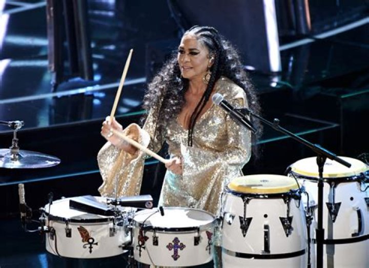 Which band has a female drummer?