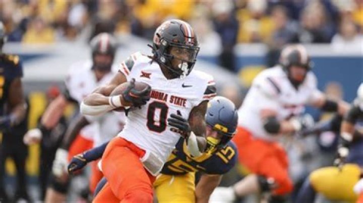 Who are the 8 players to rush for 2000 yards?