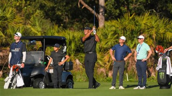 Who is Charlie Woods Caddie?