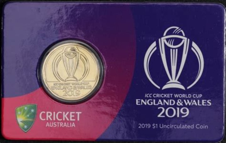 Who tosses the coin in cricket?