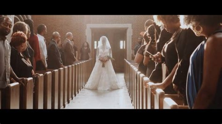 Who walks the bride's mother down the aisle?