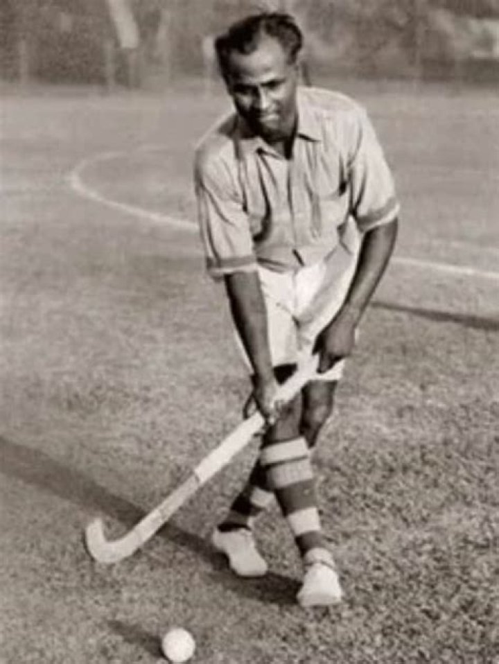 Who was Dhyan Chand's first hockey coach?
