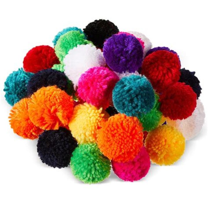 Why are pom poms on top of hats?