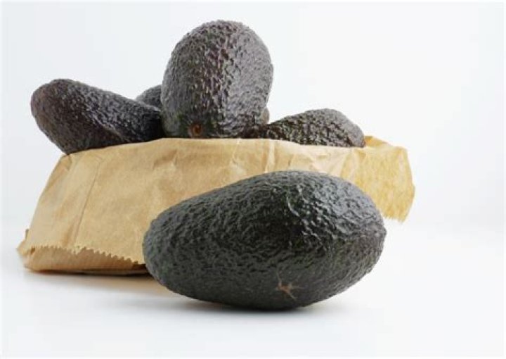 Why do avocados ripen faster in a brown paper bag?