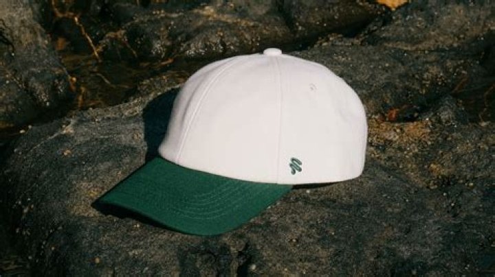 Why do hats have a button on top?