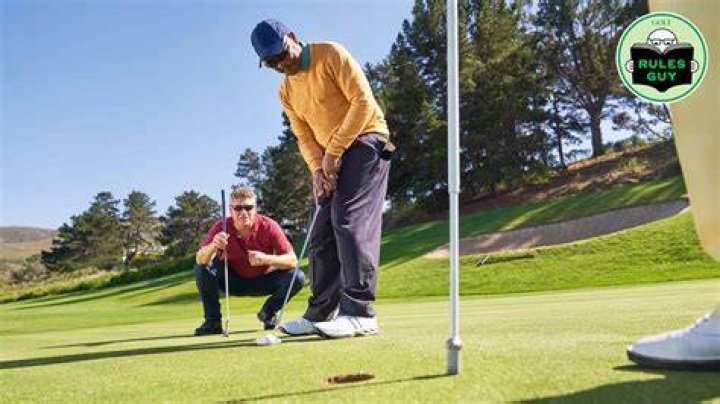Why do I putt better looking at the hole?