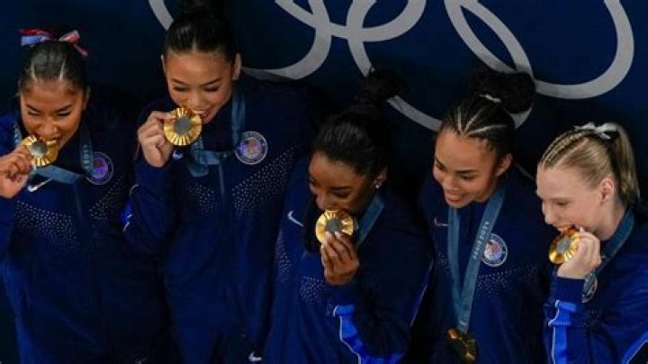 Why do metal winners bite their medals?